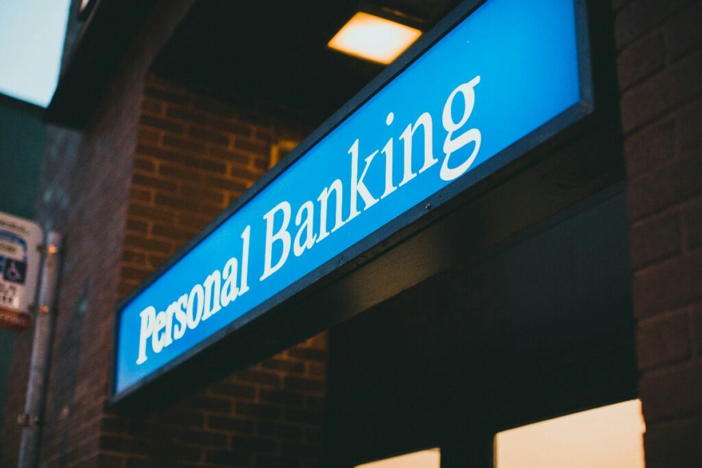 Person opening a bank account after release at a local branch personal banking desk