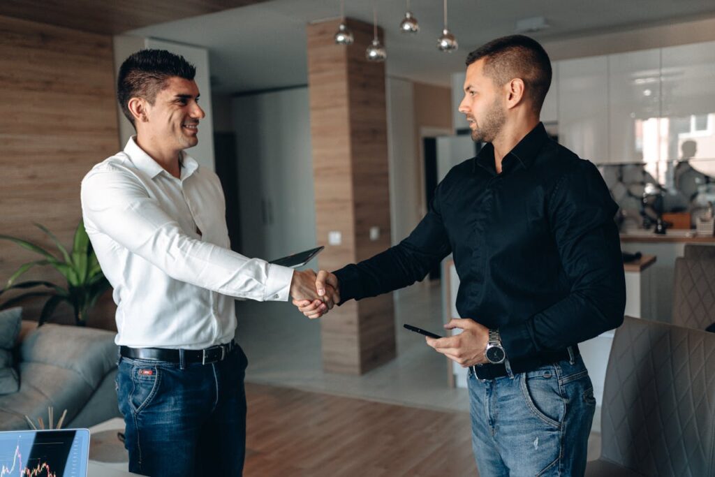 Job interview handshake between employer and applicant representing second-chance hiring opportunity
