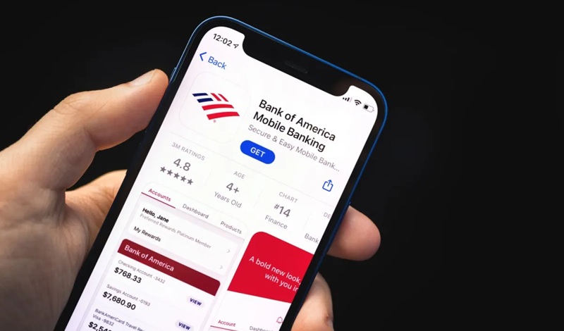 Person setting up bank mobile app and direct deposit on smartphone