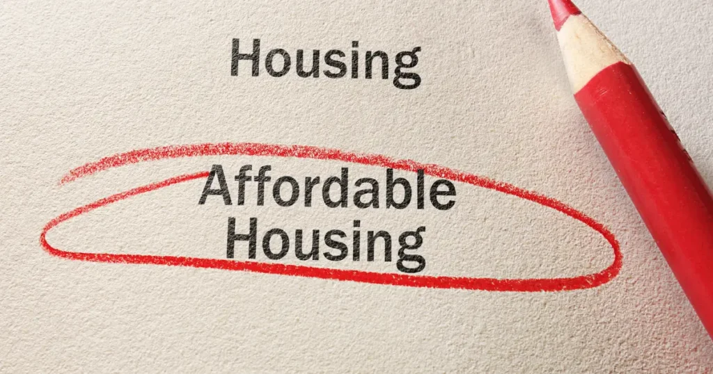Paper with "Affordable Housing" circled in red pencil next to the word "Housing" — choosing affordable housing option