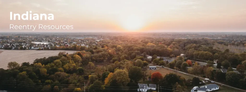 Indiana reentry resources banner with rural landscape and farmland at sunset
