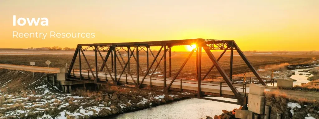 Iowa reentry resources banner with rural bridge and farmland at sunset