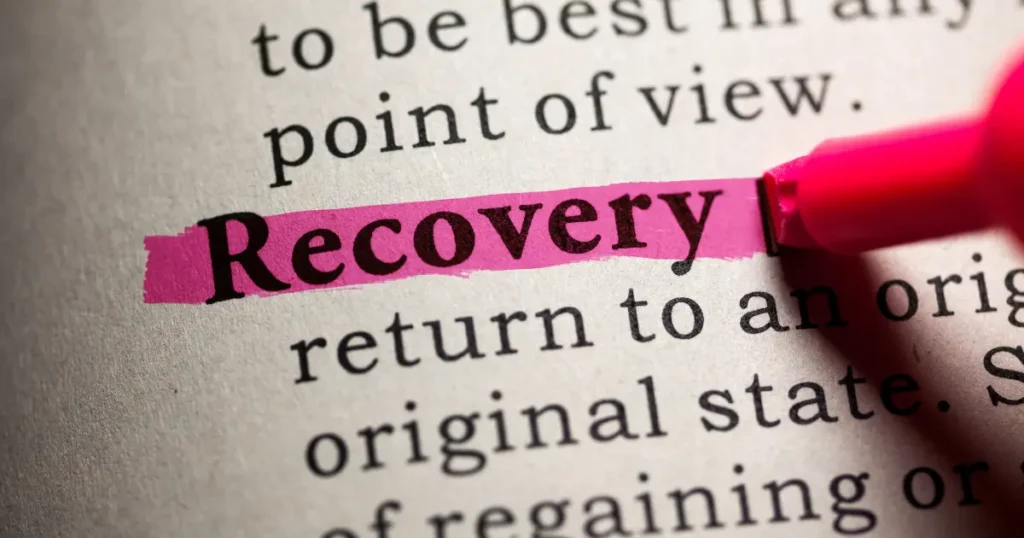 ictionary page with the word "Recovery" highlighted in pink marker